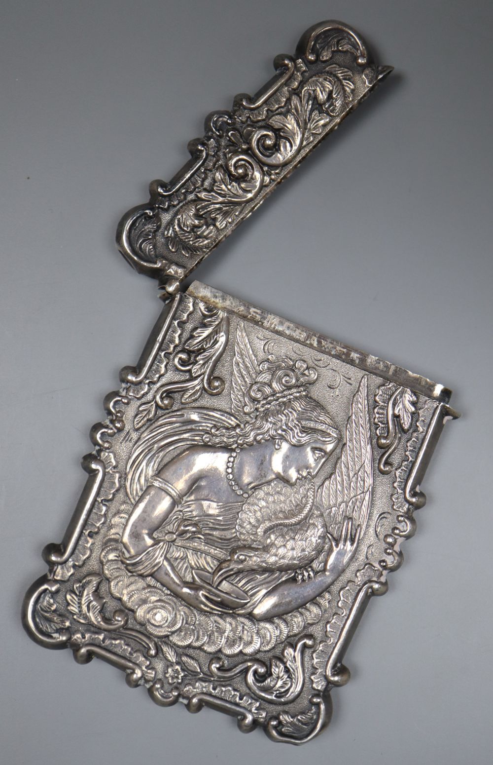 A 19th century white metal card case, the front and back embossed with Ganymede & the Eagle and cathedral, unmarked,